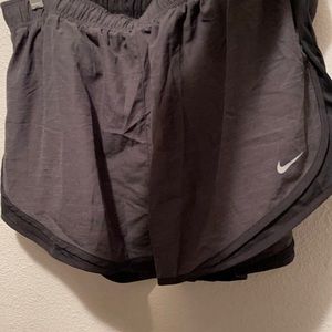 Grey and black Nike shorts